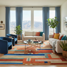 Load image into Gallery viewer, Multicolored geometric patterned rug on a wooden floor