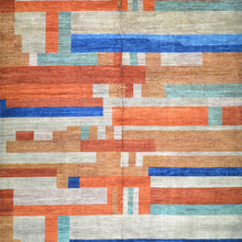 Load image into Gallery viewer, Geometric patterned rug with orange, blue, and beige colors