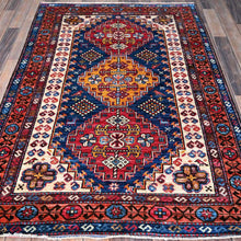 Load image into Gallery viewer, Ersari Kazak wool rug displayed on hardwood floor — Classic World Rugs Cwral-11643
