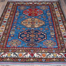 Load image into Gallery viewer, Ersari Kazak wool rug displayed on hardwood floor — Classic World Rugs Cwral-11646
