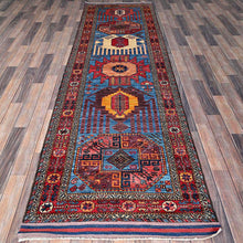 Load image into Gallery viewer, Tribal Kazak runner rug displayed on hardwood floor — Classic World Rugs Cwral-11661
