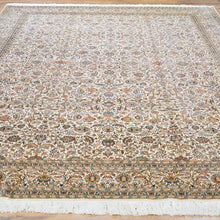 Load image into Gallery viewer, Close-up of hand-knotted Kashmiri silk rug showing intricate red floral medallion pattern
