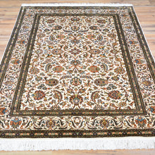 Load image into Gallery viewer, Kashmiri silk Persian design rug displayed on hardwood floor — Classic World Rugs Cwral-11679
