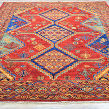 Load image into Gallery viewer, Colorful geometric patterned rug with red, blue, and orange colors on a white background