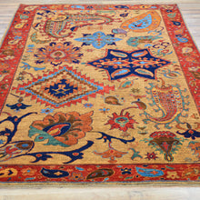 Load image into Gallery viewer, Decorative rug with intricate patterns on a wooden floor