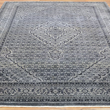 Load image into Gallery viewer, Decorative rug with intricate patterns on a wooden floor