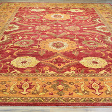 Load image into Gallery viewer, Decorative red and gold area rug with intricate patterns on a wooden floor.
