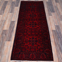 Load image into Gallery viewer, Red patterned rug on a wooden floor