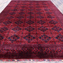 Load image into Gallery viewer, Red and black patterned rug on a wooden floor