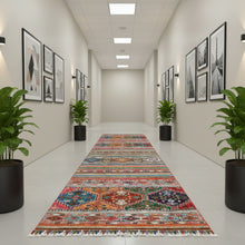 Load image into Gallery viewer, Colorful patterned rug on a wooden floor