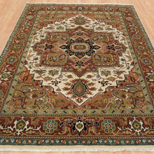 Load image into Gallery viewer, Decorative rug with intricate patterns on a wooden floor