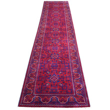 Load image into Gallery viewer, Red and blue patterned rug on a white background