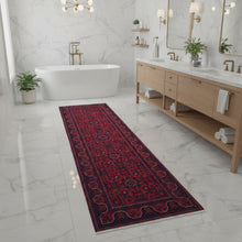 Load image into Gallery viewer, Red and blue patterned rug on a white background