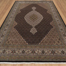 Load image into Gallery viewer, Decorative rug with intricate patterns on a wooden floor