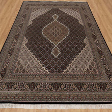 Load image into Gallery viewer, Decorative rug with intricate patterns on a wooden floor