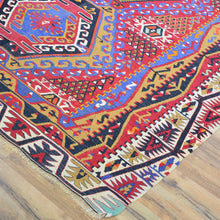 Load image into Gallery viewer, Colorful patterned rug on a wooden floor