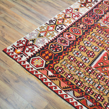 Load image into Gallery viewer, Decorative rug with intricate patterns on a wooden floor