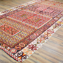 Load image into Gallery viewer, Decorative rug with intricate patterns on a wooden floor