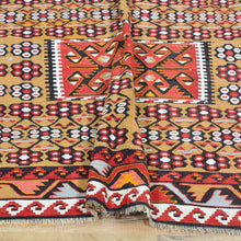 Load image into Gallery viewer, Traditional patterned rug with geometric designs on a wooden floor.
