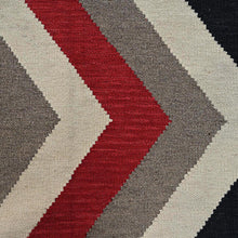Load image into Gallery viewer, Fabric swatch with red, gray, and beige chevron pattern