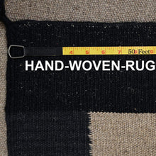 Load image into Gallery viewer, Hand-woven rug with a measuring tape indicating dimensions, featuring black and gray colors.