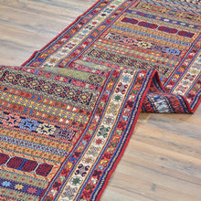 Load image into Gallery viewer, Colorful patterned rug on a wooden floor