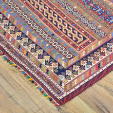 Load image into Gallery viewer, Colorful patterned rug on a wooden floor