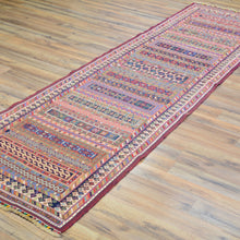 Load image into Gallery viewer, Colorful patterned rug on a wooden floor
