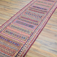 Load image into Gallery viewer, Colorful patterned rug on a wooden floor