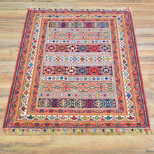 Load image into Gallery viewer, Colorful patterned rug on a wooden floor