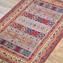 Load image into Gallery viewer, Colorful patterned rug on a wooden floor