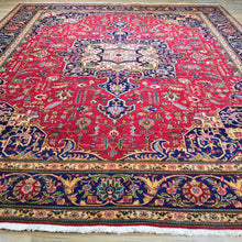 Load image into Gallery viewer, Overhead flat lay of hand-knotted Vintage Persian rug 10x13, rich red and multicolor tones — Classic World Oriental Rugs