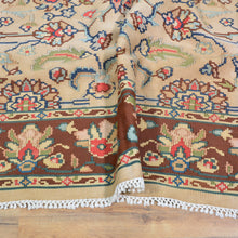 Load image into Gallery viewer, Detail shot of hand-woven wool kilim rug showing slit-weave texture and floral tribal design