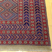Load image into Gallery viewer, Corner detail of tribal Soumak wool rug, geometric pattern in red, grey, and yellow