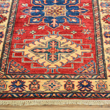Load image into Gallery viewer, 	Texture detail of hand-knotted wool Kazak runner rug, red blue green geometric weave pattern