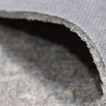 Load image into Gallery viewer, Non-slip rug pad installed under an area rug in Santa Fe, New Mexico, helping keep rugs secure and extending rug life.